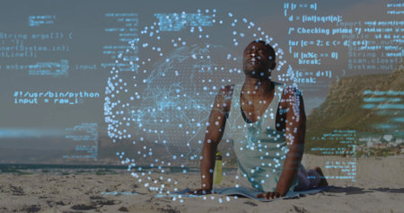 Practicing man holding cobra pose on beach mat, with reusable water bottle. Wellness, tranquility, outdoor, serenity, nature, fitnessの写真素材