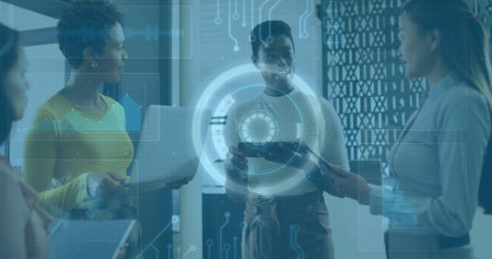 Collaborating four women in business attire discussing data in office, with devices and holograms. Technology, innovation, teamwork, corporate, communication, modern, digitalの写真素材