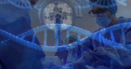 Surgical team in blue gowns performing surgery in operating room, with light and DNA helix graphic....