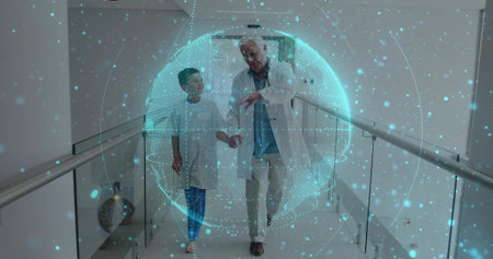 Walking doctor with stethoscope and boy in gown through hospital corridor under digital hologram. Medical, healthcare, technology, innovation, professionalism, wellness, examinationの写真素材