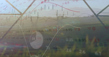 Overlaying steel transmission towers spanning field at sunrise, with financial charts and pie chart. Infrastructure, energy, technology, landscape, analytics, data visualization, ruralの写真素材