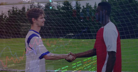 Male soccer players shaking hands near grass field goal net, with jerseys and cleats. Athletics, teamwork, competition, exercise, sportsmanship, outdoor, dynamicの写真素材