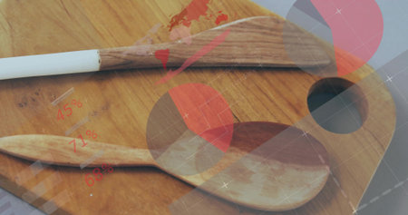 Showing spatula and spoon resting on cutting board at kitchen workspace, with digital HUD. Cooking,...