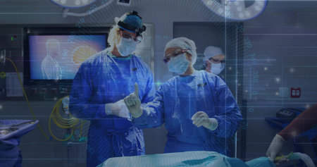 Consulting two surgeons in gowns and headlamps viewing drape in OR, with surgical lights and screen....