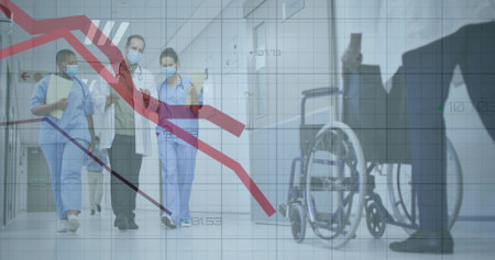 Walking staff in uniforms holding folders near wheelchair in ward corridor, displaying grid overlay....