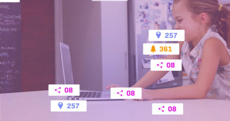 Reaching schoolgirl using silver laptop on table in office, floating notification icons, copy space....