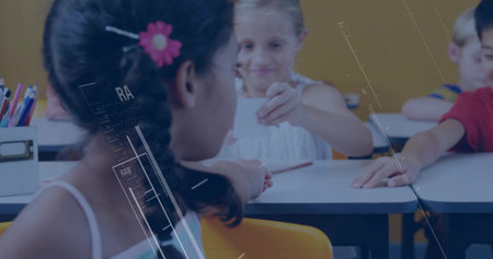 Handing paper slip girl wearing white dress passing to classmate at school desk, colored pencils. Children, education, teamwork, classroom, collaboration, learning, kidsの写真素材
