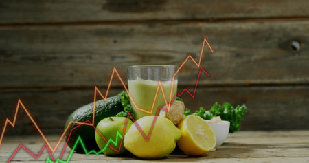 Featuring avocado, apple, lemon, ginger, kale, nut bowl, green smoothie on table. Fresh produce, health, nutrition, wellness, organic, natural, rusticの写真素材