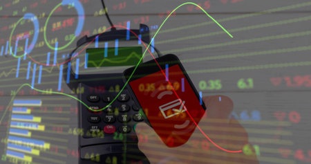 Holding smartphone showing tap icon at checkout counter, terminal overlaying stock data, copy space. Digital, fintech, technology, commerce, mobile, finance, modernの写真素材
