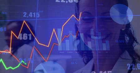Smiling woman in white blazer examining translucent grid in office, with colored lines monthly bars....