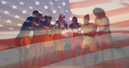 Celebrating eight friends holding sparklers on sandy beach at dusk. Festivities, camaraderie, independence, celebration, summer, outdoor, joyfulの写真素材