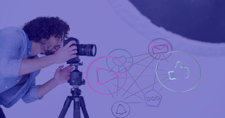Photographer in denim shirt adjusting DSLR on tripod in studio with icons overlay, copy space....