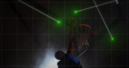 Jumping basketball player in blue jersey executing dunk in court, with green lasers gridlines smoke. Sport, action, futuristic, technology, intensity, competition, athleticismの写真素材
