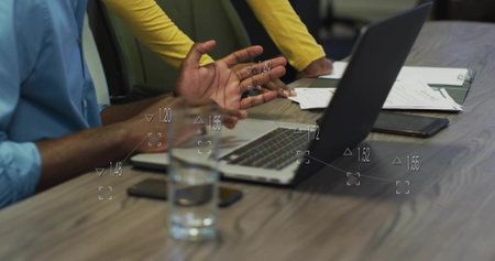 Female and male in business attire collaborating in conference room, with laptop and documents. Professional, teamwork, corporate, modern, communication, negotiation, workspaceの写真素材