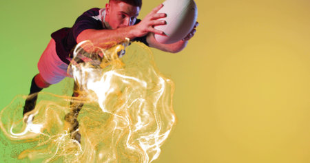 Diving rugby player wearing sports jersey catching rugby ball in studio with golden swirl effect. Athlete, action, motion, digital art, sports, dynamic, energyの写真素材