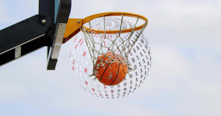 Flying basketball moving through outdoor rim and net under cloudy sky, with binary code overlay....