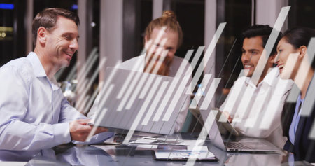 Meeting colleagues discussing data on laptops at modern boardroom with phone and futuristic overlay. Collaboration, technology, innovation, business, teamwork, futuristic, urbanの写真素材