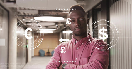Standing man wearing button-down shirt and wristwatch in office hall with floating currency symbols. Professional, finance, corporate, modern, technology, business, futuristicの写真素材