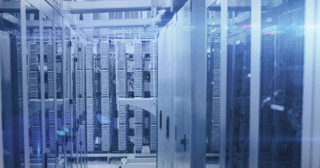 Displaying central row of server racks shining in data center, with patch panels and cables....