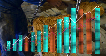 Craftsman in coveralls lifting cylinder and adjusting chain hoist in shop, with data overlay. Woodworking, craftsmanship, industrial, manual labor, manufacturing, technical, productivityの写真素材