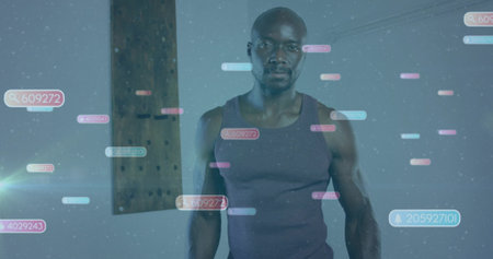 Standing athletic man wearing tank top in studio, with floating numeric overlays and wooden beam. Futuristic, technology, digital, interface, innovation, minimalist, concentrationの写真素材