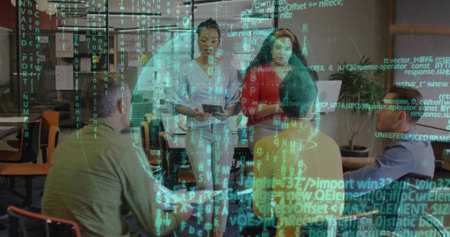 Collaborating team of five in business attire gathering around table in office with laptop tablet. Collaboration, teamwork, office, technology, corporate, communication, brainstormingの写真素材