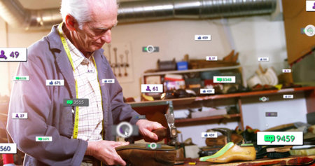Inspecting shoemaker wearing blue jacket in shoe repair shop, with leather upper and metal last. Craftsmanship, workshop, artisanal, tools, manual, renovation, industrialの写真素材