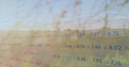 Displaying floating numeric figures and rising line graph over transmission towers in rural field. Financial analysis, data visualization, rural landscape, energy infrastructure, technological innovation, environmental monitoring, digital graphicsの写真素材
