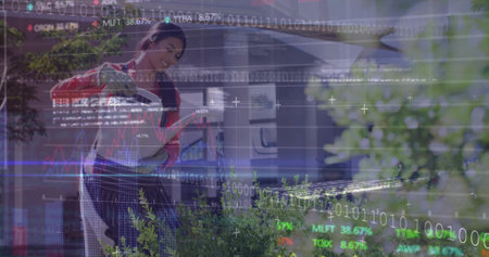 Watering shrubs woman wearing apron with metal watering can in front yard, with financial overlay. Gardening, outdoor, nature, landscape, eco-friendly, wellness, growthの写真素材
