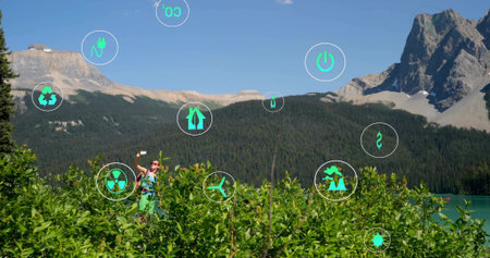 Holding smartphone, woman in hiking gear by lake, with backpack, sunglasses, copy space. Adventure,...