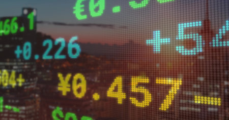 Showing transparent LED-style financial grid over skyscraper skyline at dusk with currency symbols. Technology, finance, data visualization, urban, modern, digital, businessの写真素材
