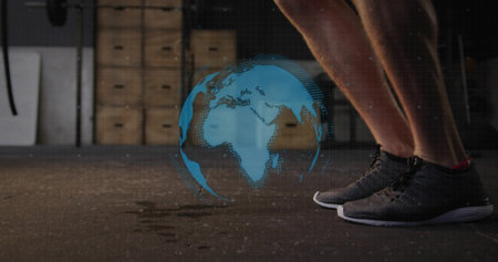 Performing jump rope with lower legs and feet at gym, floating holographic globe, copy space....