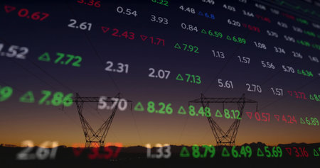 Featuring two transmission towers with lines in field at dusk with floating red green stock numbers. Industrial, utility, sunset, finance, technology, landscape, infrastructureの写真素材