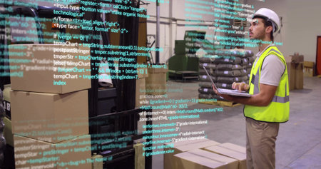 Worker in safety vest scanning on laptop at warehouse with boxes, code overlay, copy space....