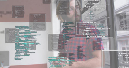 developer typing code at office desk wearing red flannel shirt with monitor and code overlays. Technology, innovation, workflow, urban, productivity, modern, creativeの写真素材