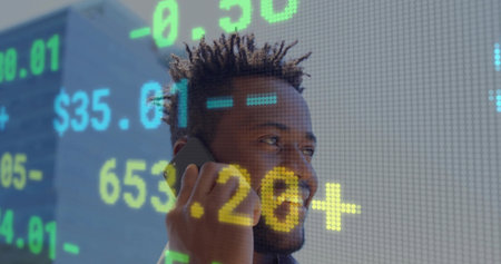 Businessman talking on smartphone in suit on city street with digital stock ticker overlay. Professional, urban, modern, financial, technology, corporate, digitalの写真素材