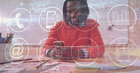 Mid adult man wearing sweatshirt holding smartphone analyzing charts in office, with digital icons....