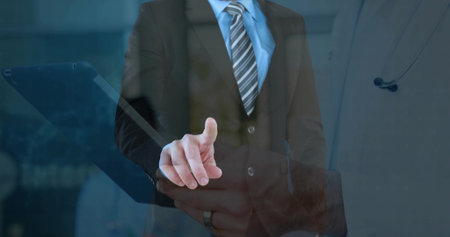 Pointing professional wearing suit activating touchscreen in office, with stethoscope reflection. Corporate, technology, futuristic, medical, innovation, professionalism, sleekの写真素材