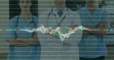 Standing medical team monitoring line graph overlay in hospital corridor, data markers visible. Healthcare, professionalism, data visualization, digital, collaboration, precision, innovationの写真素材