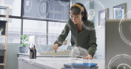 Leaning architect drawing precise arcs on drafting table in office, with compass and blueprints....