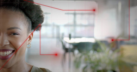 Smiling African American woman wearing green top in boardroom with red network overlay, copy space. Professional, network, communication, collaboration, modern, vibrant, technologicalの写真素材