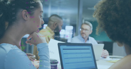 Sitting Asian woman supporting chin at meeting table with laptops and code reflection, copy space. Collaboration, innovation, technology, brainstorming, professionalism, modern, digitalの写真素材