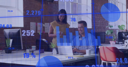 Data professionals in business attire reviewing data using laptop and monitors at office. Collaboration, digital, innovation, modern, workspace, analytics, productivityの写真素材