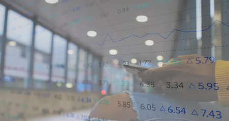 Tapping traveler hands navigating smartphone screen in airport lounge, with financial data overlay. Urban, modern, technology, finance, connectivity, professional, vibrantの写真素材