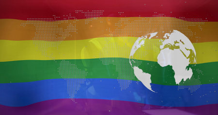 Displaying rainbow-striped flag with overlaid dotted world map and white globe on digital banner. Lgbtq+, activism, diversity, inclusivity, advocacy, unity, vibrantの写真素材