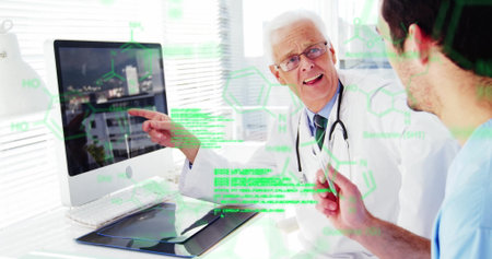 Pointing senior doctor explaining molecules to junior doctor in clinic, with computer, stethoscope....