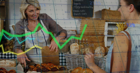Serving bakery attendant wearing striped apron slicing pastries at wood counter, with data overlay....