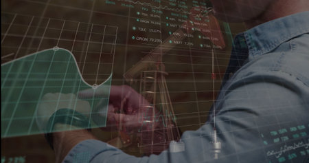 Adjusting musician tuning guitar headstock in studio, with market data overlay, copy space....