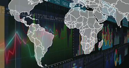 Displaying white world map overlaying digital screen, with line graphs and bar charts. Geography,...
