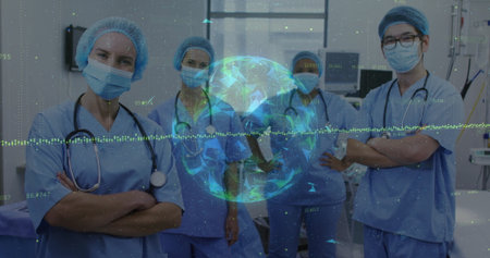 Standing medical team wearing scrubs and masks in operating room, with holographic globe overlay. Medical, teamwork, clinical, innovation, collaboration, technology, diagnosticsの写真素材